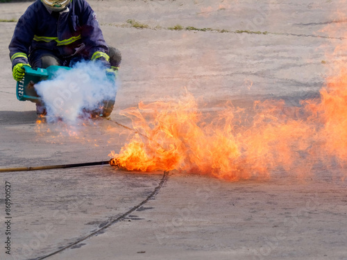 Canvastavla Firefighter Demonstrating How to Extinguish Fire with Fire Extinguisher