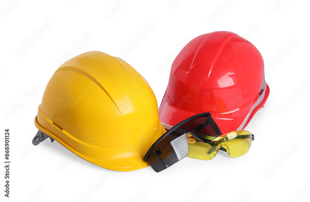 Fototapeta premium Hard hats and protective goggles isolated on white