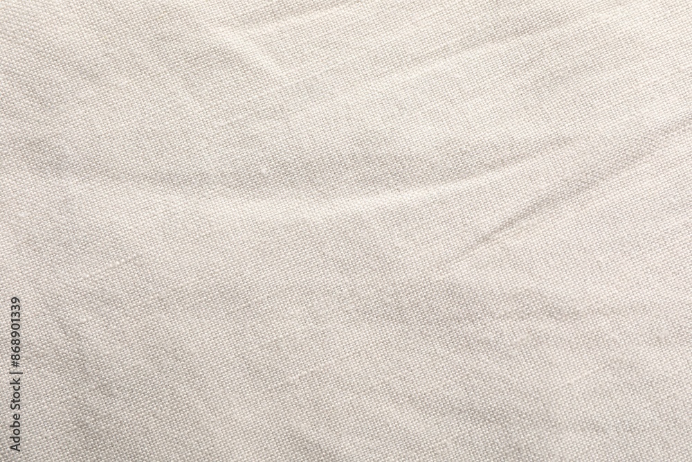 Naklejka premium Texture of beige fabric as background, top view