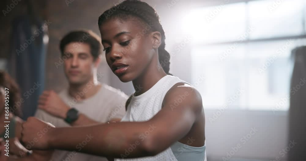 Woman, training and personal trainer with boxer for self defense, workout or exercise at indoor gym. Female person or fighter with coach for punching, martial arts or boxing together at health club Woman, training and personal trainer with boxer for self defense, workout or exercise at indoor gym. Female person or fighter with coach for punching, martial arts or boxing together at health club