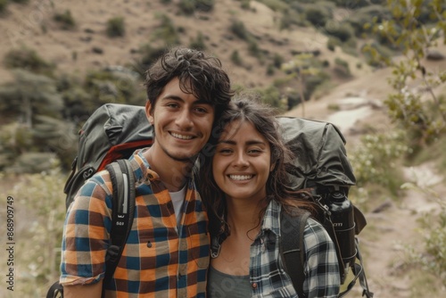 Portrait of a young couple hiking in beautiful scenery © Baba Images