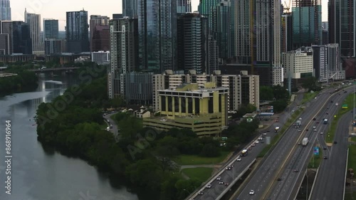 Aerial view of traffic in front of the Austin skyline, moody evening in TX, USA photo