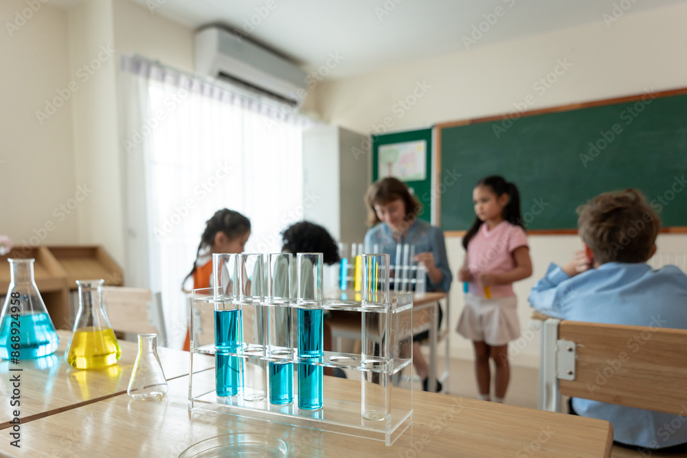 Adorable student learn with teacher in classroom at elementary school. Adorable student learn with teacher in classroom at elementary school.