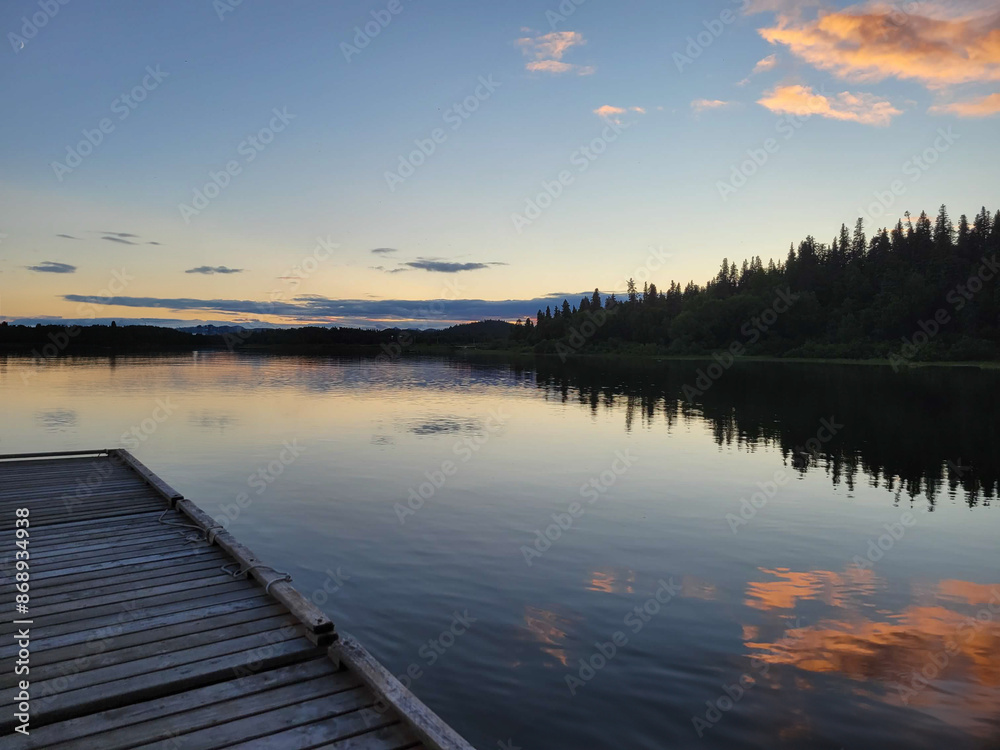 Sunset on the dock and lake Sunset on the dock and lake