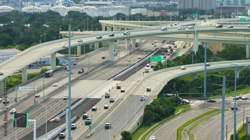 Massive highway intersection in American city area. Stacked elevated interchange lanes for express passing of car traffic. Tampa, Florida Massive highway intersection in American city area. Stacked elevated interchange lanes for express passing of car traffic. Tampa, Florida