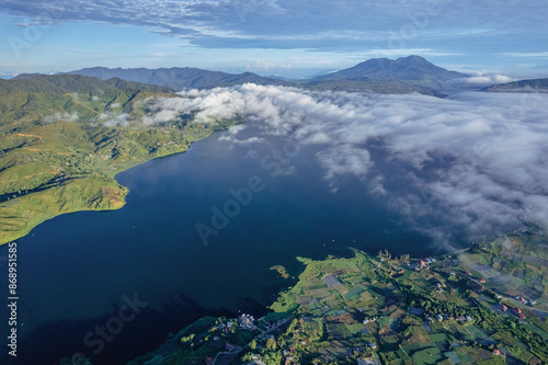 view of the lake with a mountain backdrop in Alahan Panjang, Solok Regency, West Sumatra photo