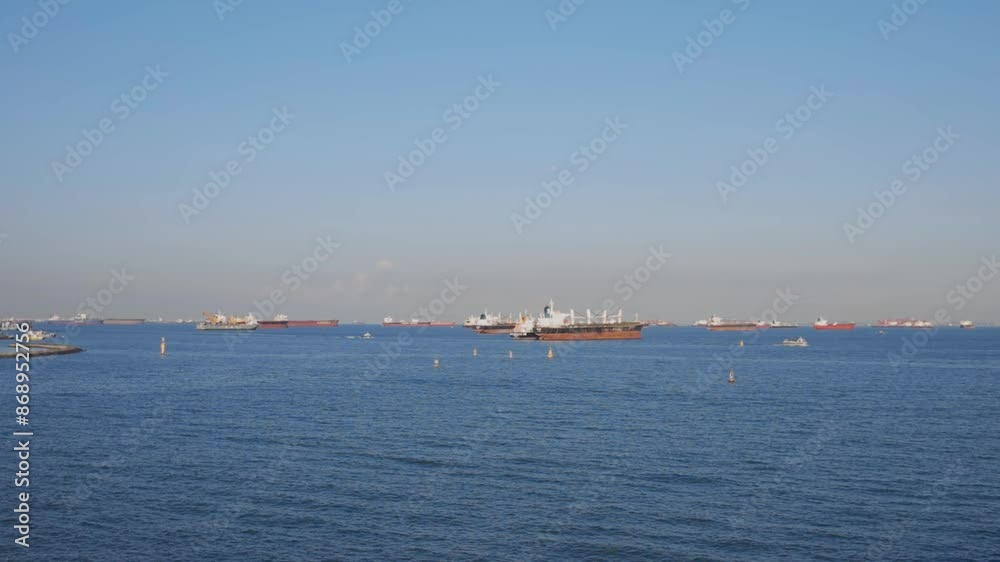 Tracking Shot Of Cargo Vessel On The Ocean Under Sunny Day