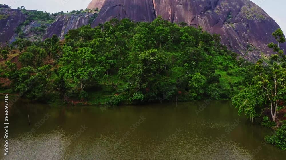Beautiful aerial of a lush, green forest at the foot of ASO rock located in Abuja, Nigeria. A beautiful African landscape presents itself on a sunny summer day Beautiful aerial of a lush, green forest at the foot of ASO rock located in Abuja, Nigeria. A beautiful African landscape presents itself on a sunny summer day