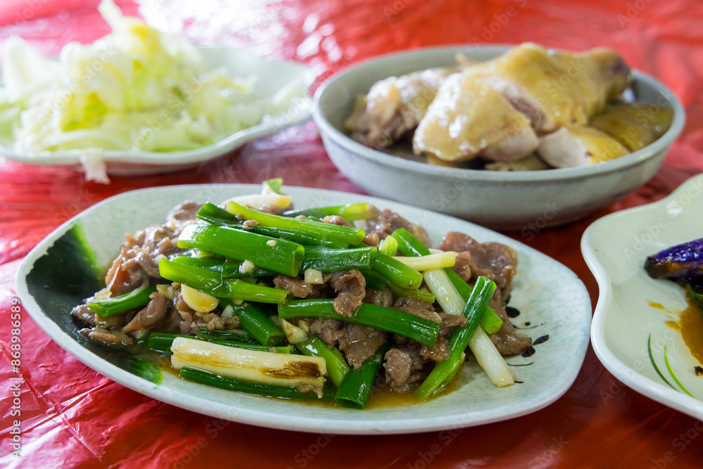 Fried beef with vegetable and chicken in the restaurant Fried beef with vegetable and chicken in the restaurant