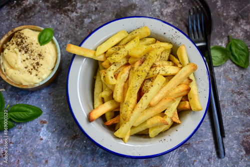  Home made   Fresh fried French fries  in a bowl on wooden rustic  background