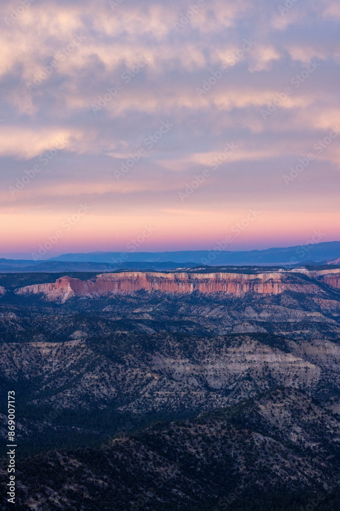 Witness the aweinspiring sunset view of Bryce Canyon National Park in Utah, featuring the rugged rocks and vibrant colors of the sky during this extraordinary scene of natural beauty Witness the aweinspiring sunset view of Bryce Canyon National Park in Utah, featuring the rugged rocks and vibrant colors of the sky during this extraordinary scene of natural beauty