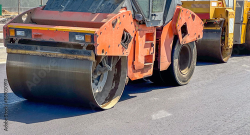 Rollers roll or lay new or fresh asphalt