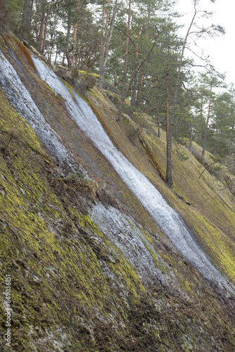 Beautiful huge boulders in the Tividen National Park in Sweden. Natural springtime scenery of forest in Scandinavia. photo