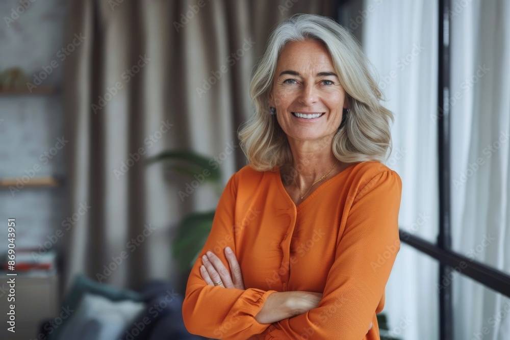 Portrait of confident smiling middle aged woman with crossed arms Portrait of confident smiling middle aged woman with crossed arms
