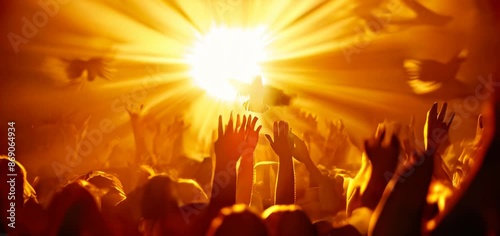 The hypnotic light, silhouettes of people with their hands raised in the air, holy spirit dove flying above them, golden hour.