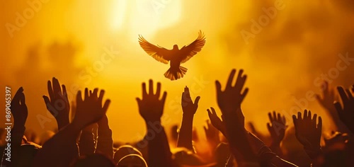 The hypnotic light, silhouettes of people with their hands raised in the air, holy spirit dove flying above them, golden hour.