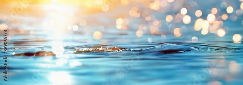 Blurred blue sea water with sunlight and bokeh background