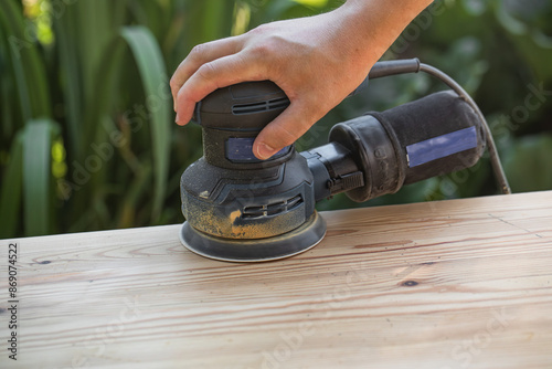 Canvas Print Grinding with an electric wood grinder, restoration of solid wood furniture