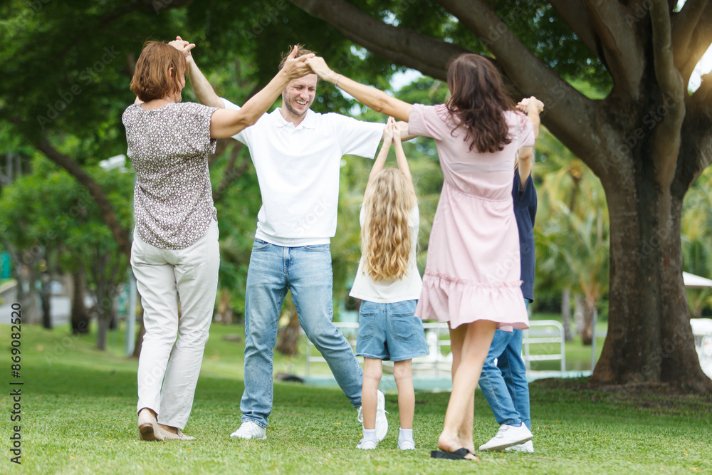 Obraz premium Family with children walking at the park.
