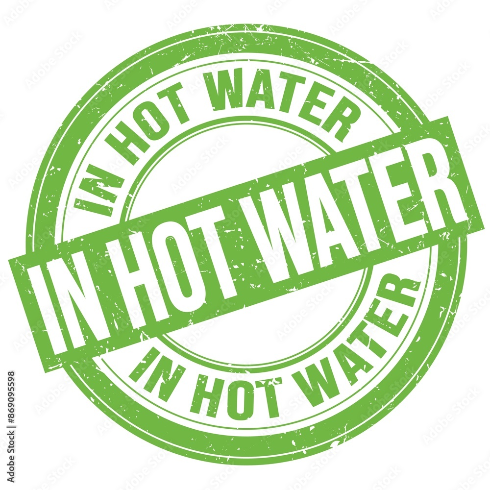 IN HOT WATER text written on green round stamp sign IN HOT WATER text written on green round stamp sign