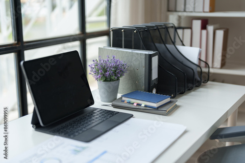 Picture of a desk in the office calculator equipment Workbook to calculate the financial results of the company in the office and work, taxes, accounting, statistics and online business ideas.