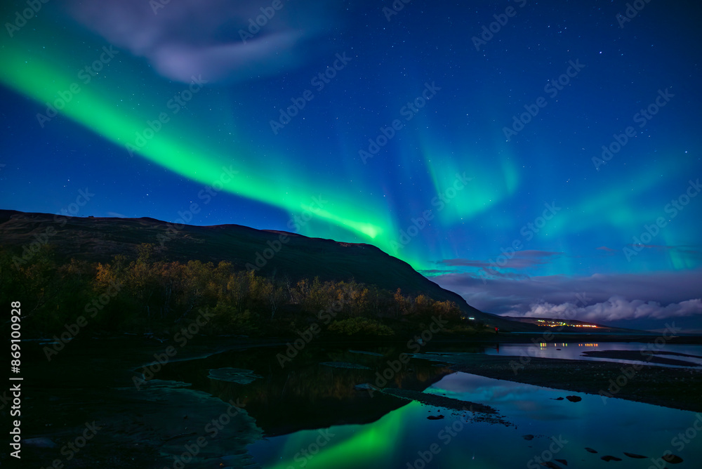 Monnlight lake with dancing of northern light in Abisko national park in north of Sweden Monnlight lake with dancing of northern light in Abisko national park in north of Sweden