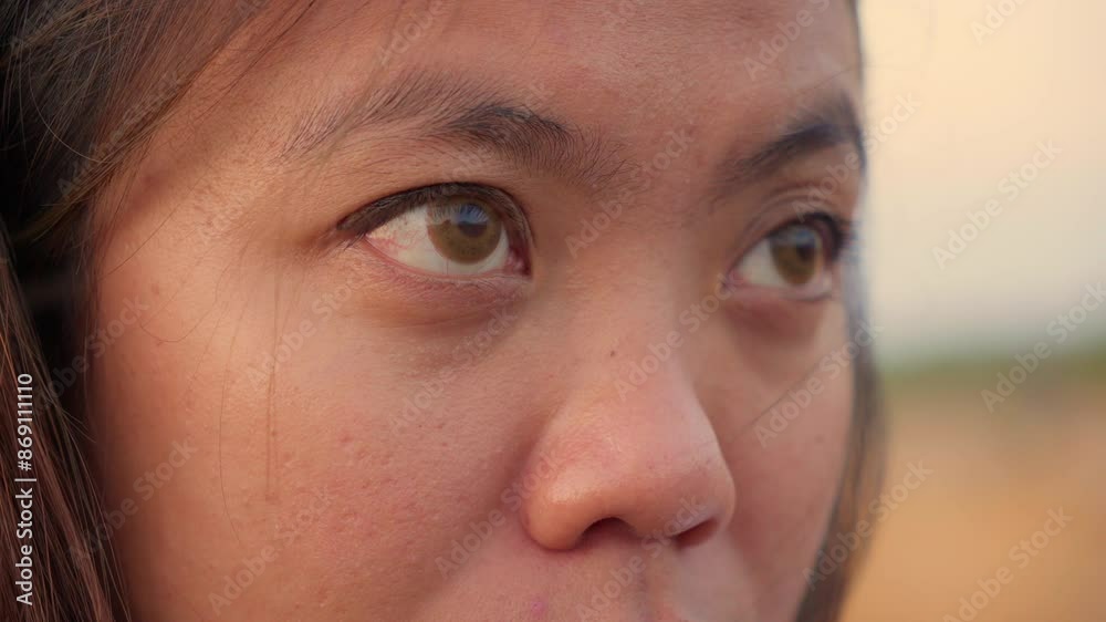 Young woman in Indonesia stares intently, captured in slow motion Young woman in Indonesia stares intently, captured in slow motion