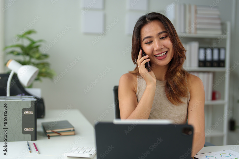 Asian businesswoman using laptop, online and smartphone to contact customers Business ideas in the office Data analysis, plans, marketing, calculations, accounting, auditing. Asian businesswoman using laptop, online and smartphone to contact customers Business ideas in the office Data analysis, plans, marketing, calculations, accounting, auditing.