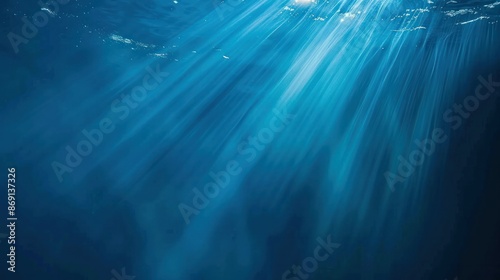 Underwater scene with sunlight piercing through the water, creating a serene and mystical aquatic atmosphere.