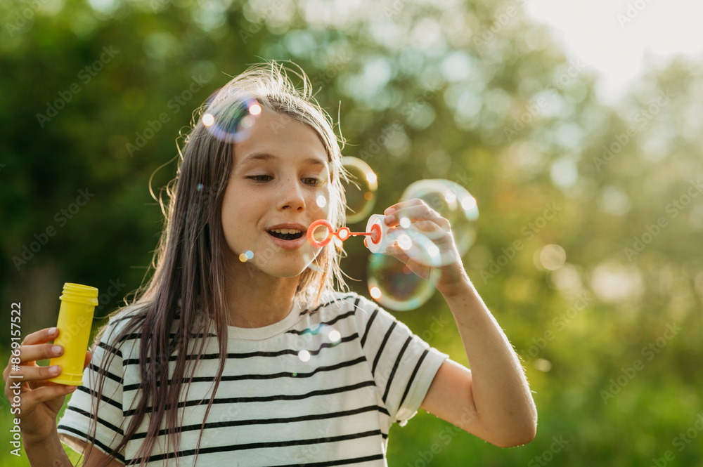 Excited girl blowing soap bubble Excited girl blowing soap bubble