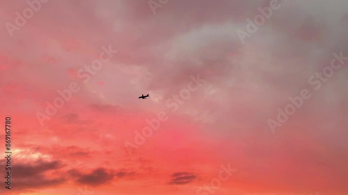 Wallpaper Mural Silhouette of a passenger plane flying before landing on the background of an amazing sunset orange-red sky. Torontodigital.ca