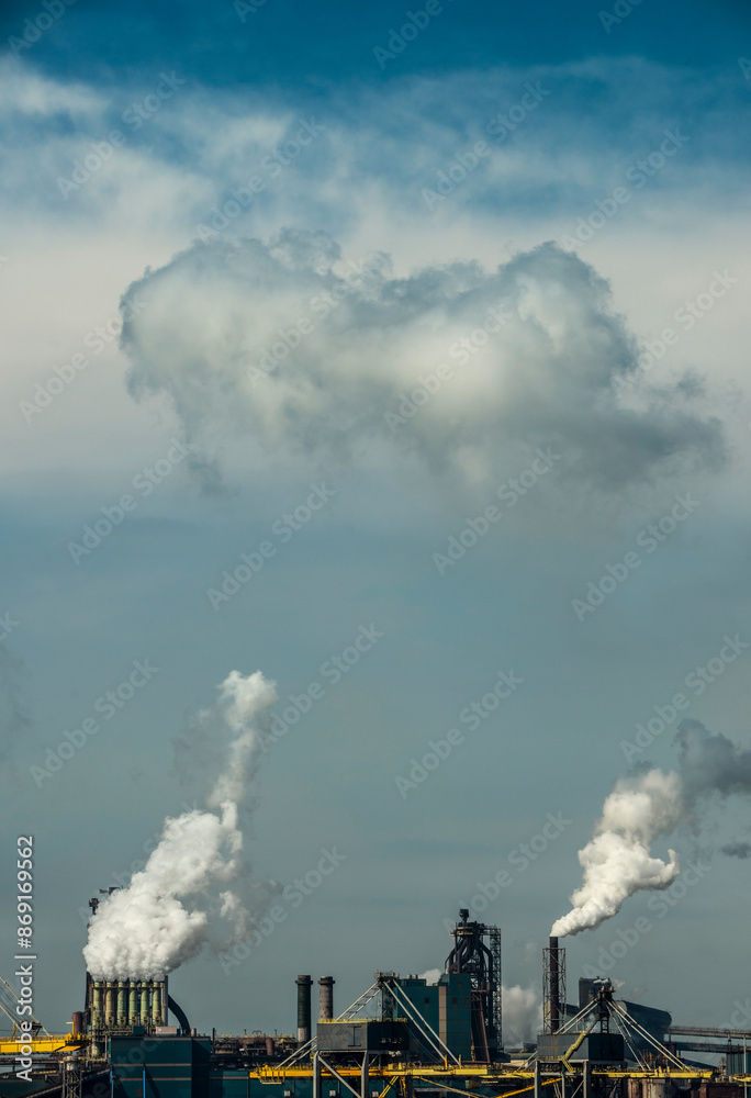 Smoke emitting through chimneys on factory under sky Smoke emitting through chimneys on factory under sky