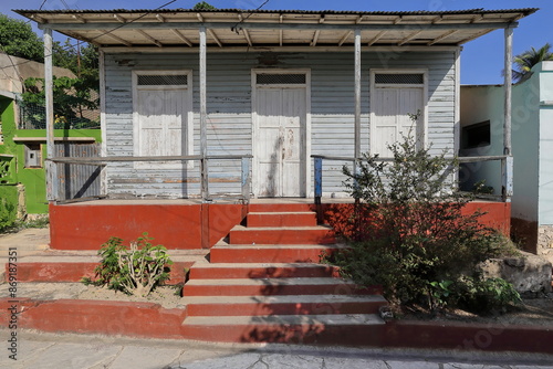 Vernacular wooden house of timber planks with porch on concrete platform and sheet metal roof, Cayo Granma Key fishing community. Santiago-Cuba-456