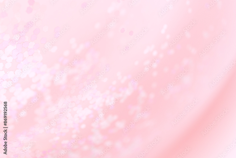 Pink blurred background with glitter confetti, pastel rose pink color Pink blurred background with glitter confetti, pastel rose pink color