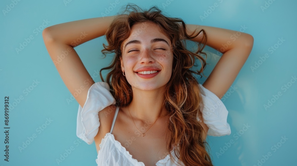A young woman wearing a white dress leaning against the wall A young woman wearing a white dress leaning against the wall