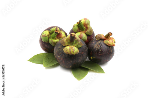 Fresh mangosteen and leaves on a white background photo