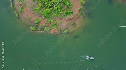 Aerial view of fishing boat in dam Thailand.