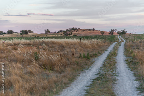 Pastel sunset, gravel trail and grassland in Galong, NSW Australia