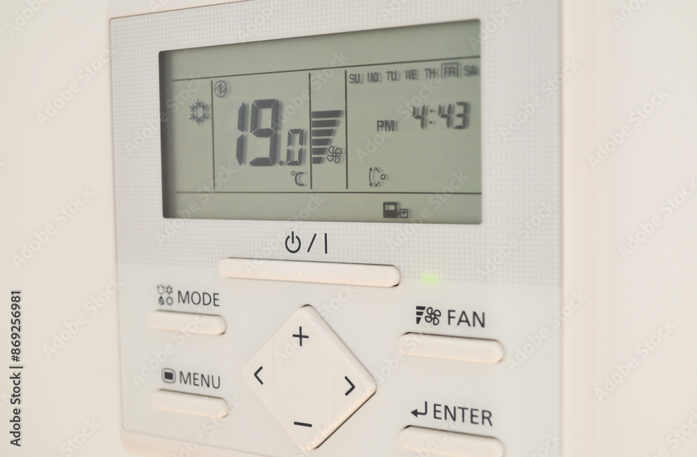 A wall-mounted air conditioner device paired with a remote control provides efficient cooling for hot weather. The sleek design and modern technology ensure indoor comfort and temperature regulation i A wall-mounted air conditioner device paired with a remote control provides efficient cooling for hot weather. The sleek design and modern technology ensure indoor comfort and temperature regulation i