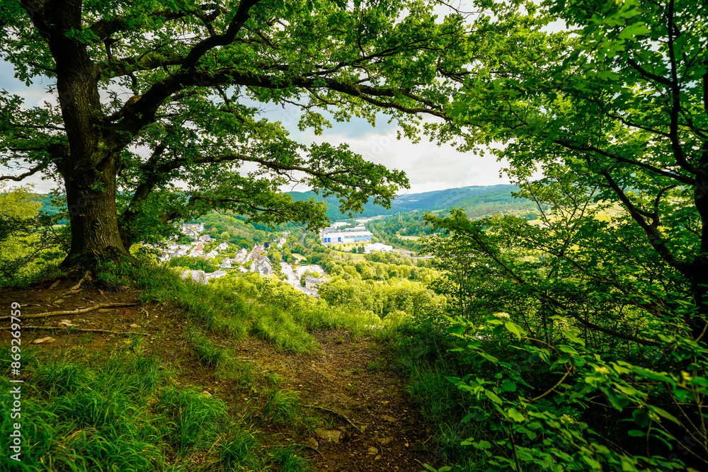 Fototapeta premium View from the Oestrich castle hill near Iserlohn. Landscape with green nature and mountains. 