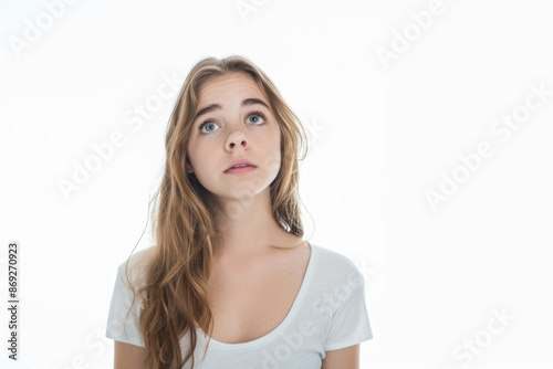 A woman with a surprised expression looking up