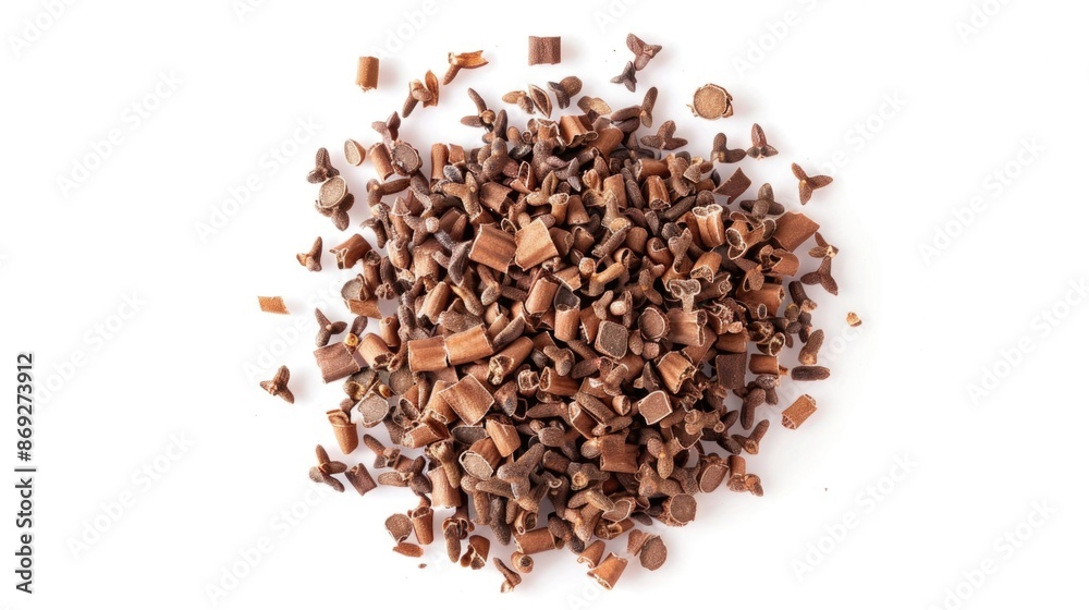 A stack of chocolate chips on a clean white surface, perfect for baking or decorating A stack of chocolate chips on a clean white surface, perfect for baking or decorating