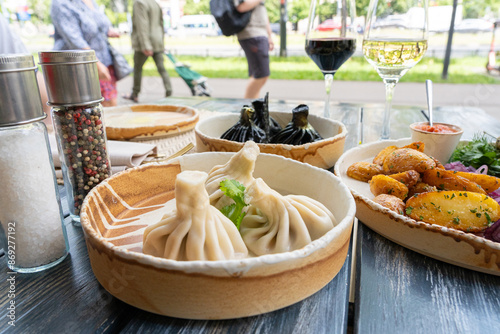 Georgian khinkali, minced meat chinkali, spicy dumplings also called dimsum, momo, jiaozi, manti photo