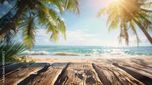 Fototapeta Naklejka Na Ścianę i Meble -  A wooden table on a sunny beach with palm trees in the background, perfect for a relaxing outdoor setting
