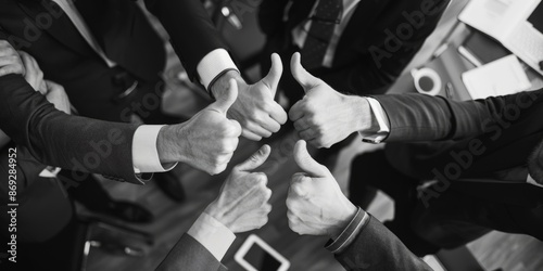 Group of professionals giving thumbs up for approval or agreement, suitable for corporate or entrepreneurial use