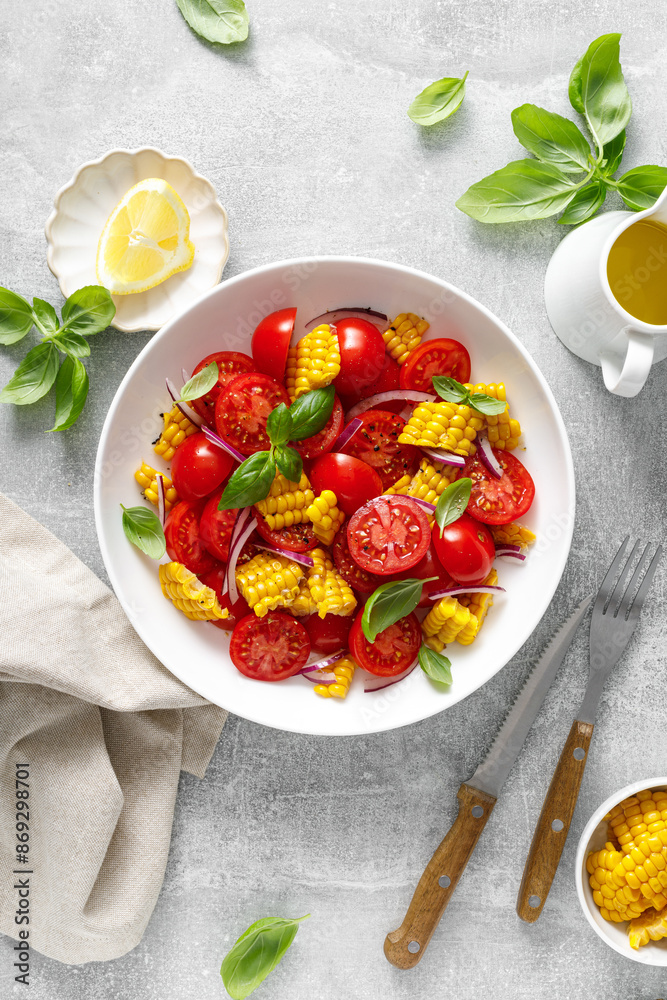 Tomato and corn salad with fresh basil, onion, dressed with olive oil. Mexican food, tomato corn salad Esquites, top view Tomato and corn salad with fresh basil, onion, dressed with olive oil. Mexican food, tomato corn salad Esquites, top view