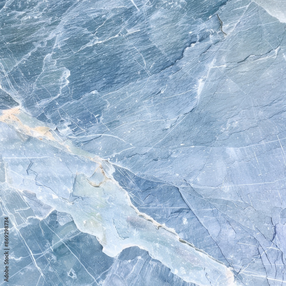 Obraz premium A highly detailed close-up photograph of blue toned marble rock with intricate veining and visible texture, showcasing the natural beauty and patterns of the stone.