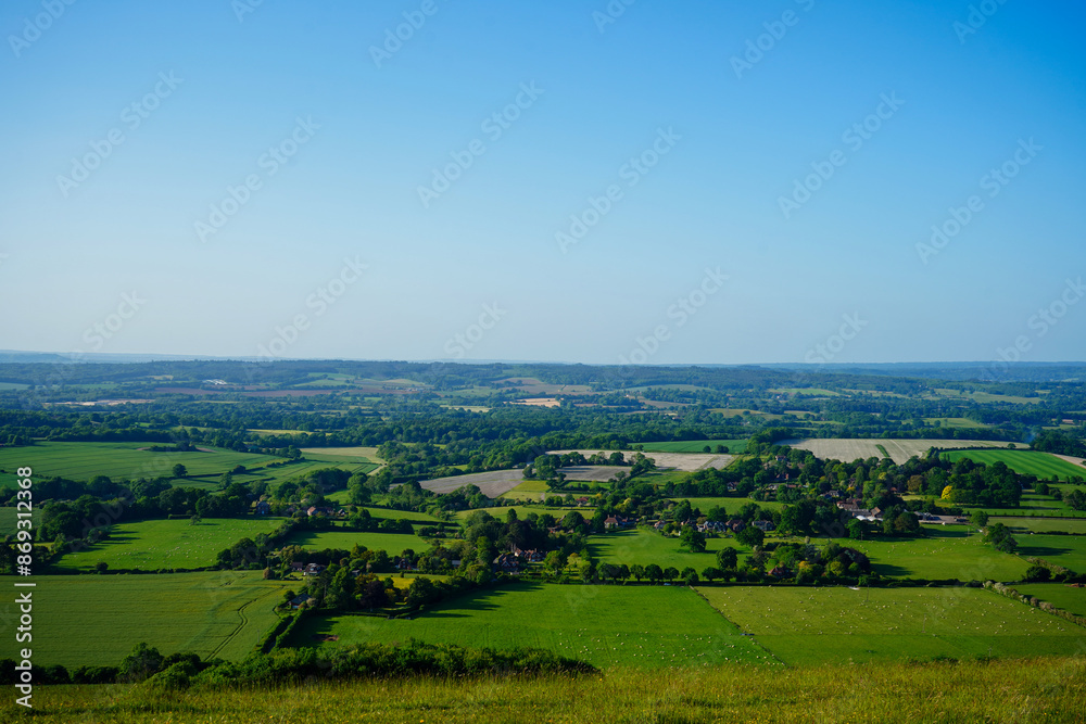 Obraz premium View of green farm fields and blue sky in the South of England
