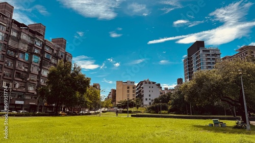 blue sky, white cloud and green grass in summer time photo