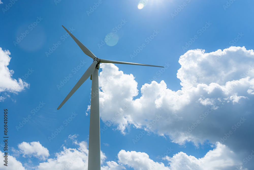 Wind power generator against a cloudy sky. Wind power generator against a cloudy sky.